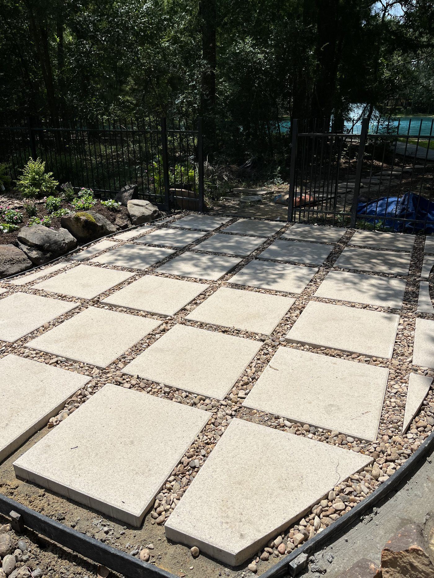 Paver patio with river rock infill Kingwood TX