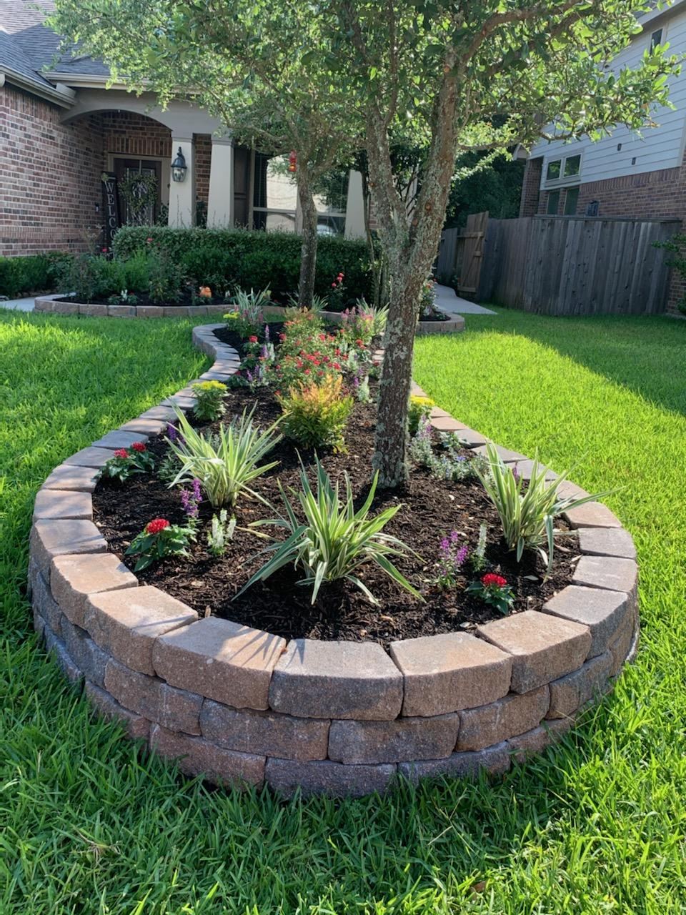 Circular retaining wall flower bed Houston TX