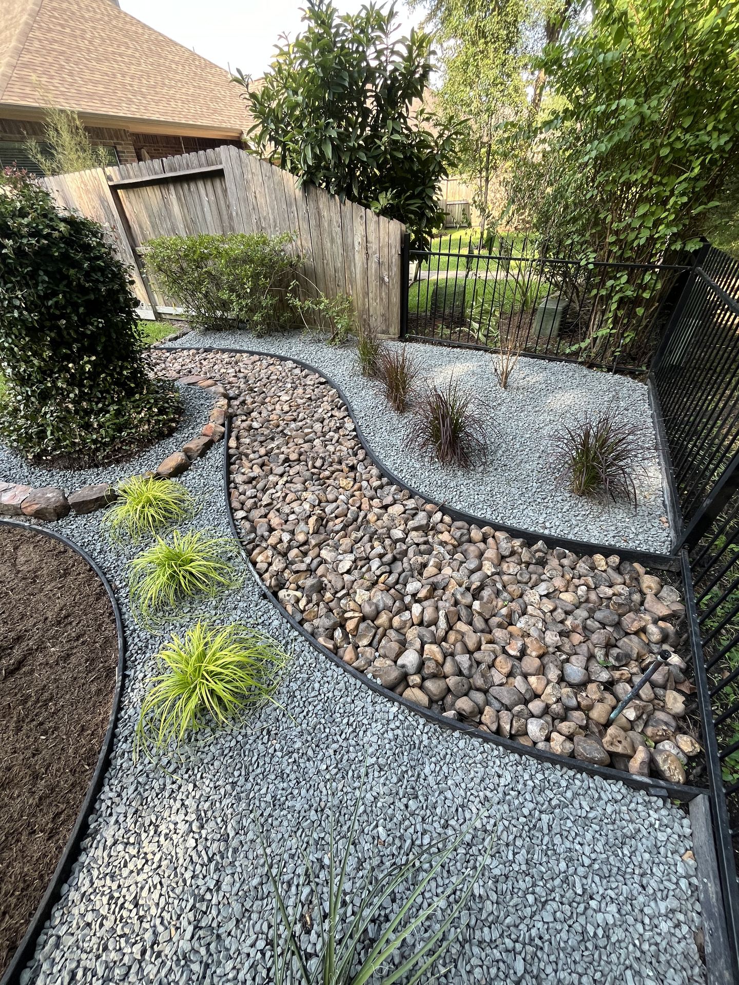 River rock and gravel landscape design Kingwood TX