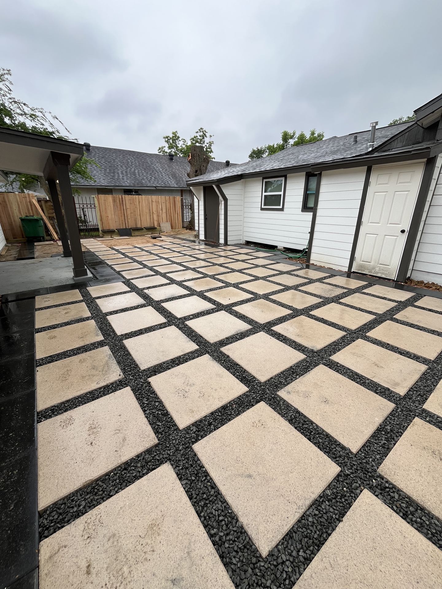 Checkerboard paver patio with gravel joints Houston TX